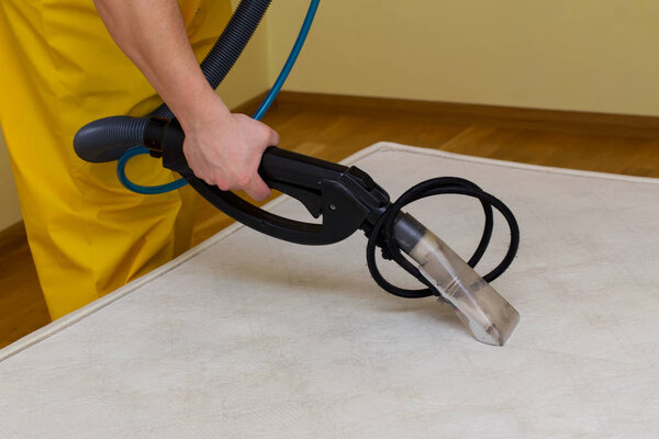 dry cleaning of an old white mattress