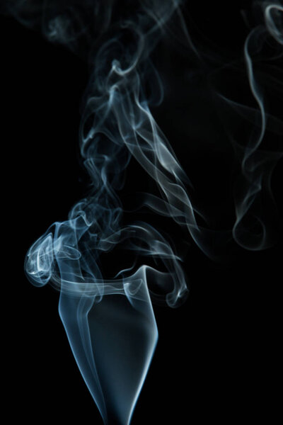 Wavy white smoke on a black background