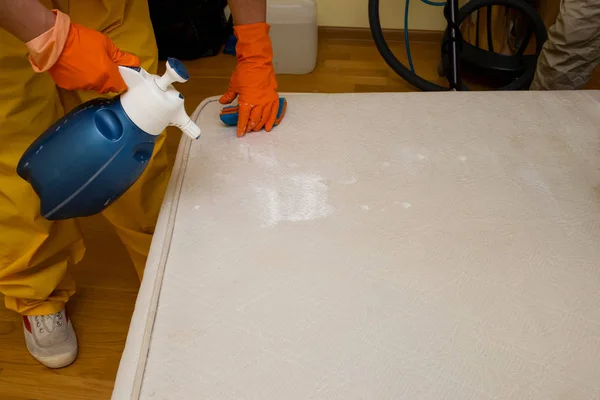 dry cleaning of an old white mattress
