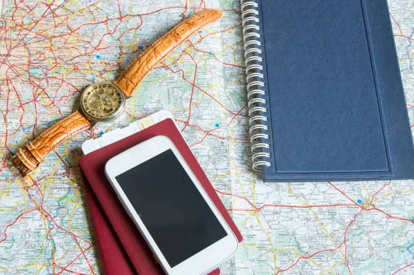 Diary and a passport, hours, map, travel concept trip