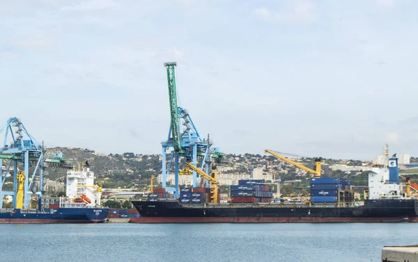 View from the sea to the industrial Harbor of Marseille with cargo cranes, ships and terminals. The largest commercial port in the South of France — Stock Photo, Image