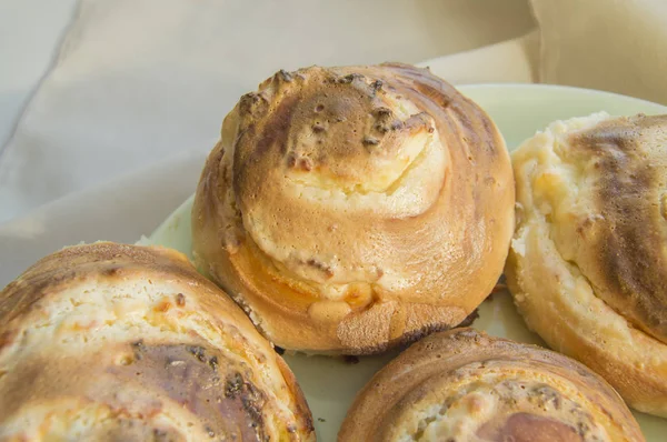 Hot sweet rolls in the shape of snails baked in a homemade bakery, closeup, concept of small business, bakeries, mini-hotel