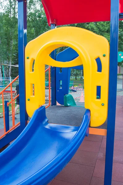 Colorful childrens Playground with slides and swings outdoors in the Park in summer — Stock Photo, Image