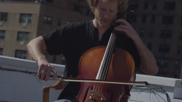 Caucasian Adult Man Playing Cello Rooftop — Stock Video