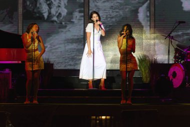 PANENSKY TYNEC, CZECH REPUBLIC - JUNE 29, 2018: Famous American singer Lana Del Rey (in the middle) during her performance at Aerodrome festival in Panensky Tynec, Czech Republic, June 29, 2018. clipart