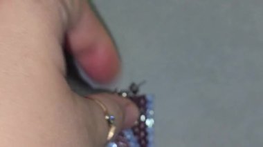 Handmade beaded and glass bead earrings on a light background. Copy space