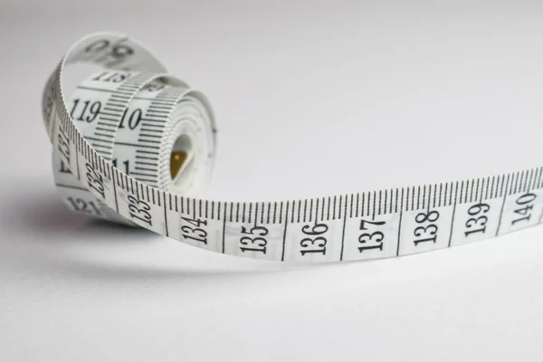 Close up of a rolled tape measure — Stock Photo, Image