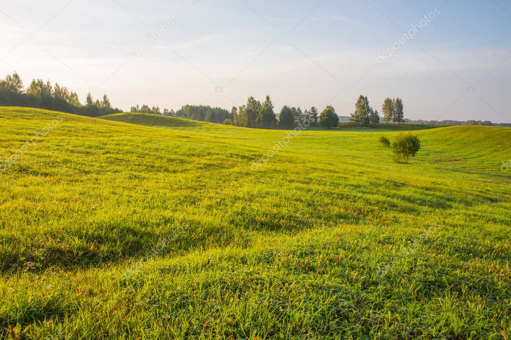 City of Kraslava, Latvia. Early morning with sunlight, meadow and trees. Nature photo. Travel photo 2018.