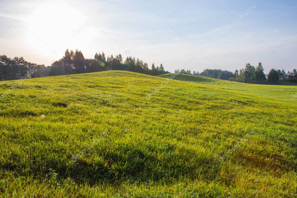 City of Kraslava, Latvia. Early morning with sunlight, meadow and trees. Nature photo. Travel photo 2018.