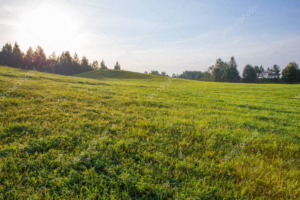 City of Kraslava, Latvia. Early morning with sunlight, meadow and trees. Nature photo. Travel photo 2018.