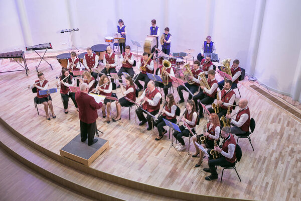 Attempt orchestra in culture house. Blowing instruments and peop