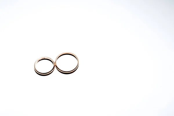City Riga, Latvian Republic. Two golden rings with white backgro — Stock Photo, Image