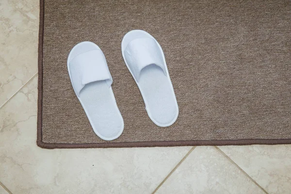 City Amatciems, Latvian republic. Guest room with clean slippers — Stock Photo, Image