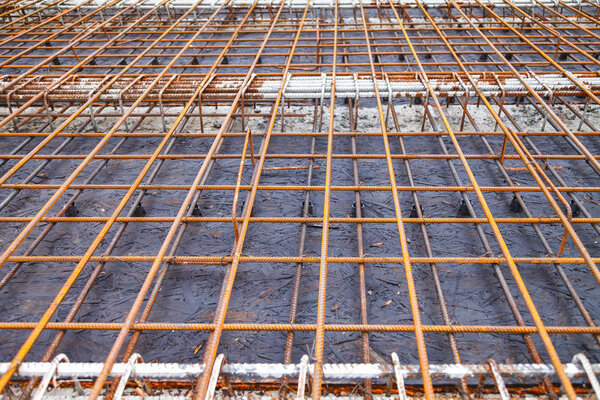 Construction of a new building, binding of reinforcement