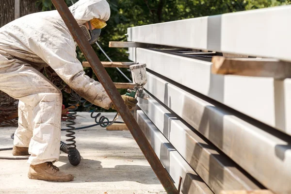 Man Protective White Overall Wears Metal Pipes Light Paint Using — Stock Photo, Image