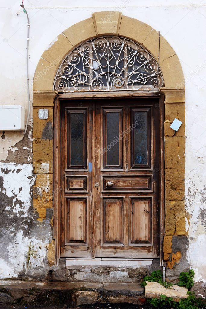 Antique brown wooden doors. Travel and walking