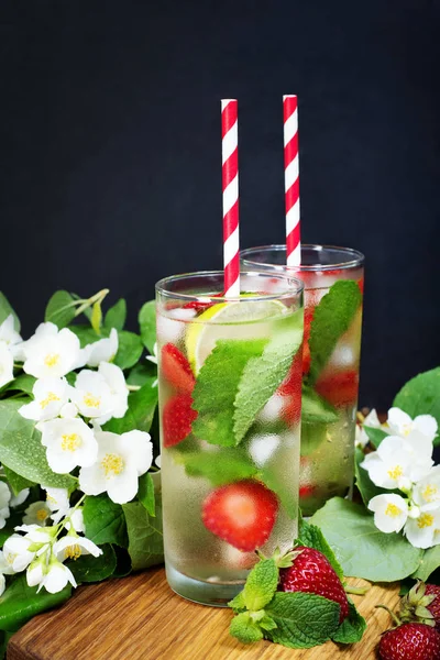 Summer cooling non-alcoholic cocktail. Green tea, strawberries,