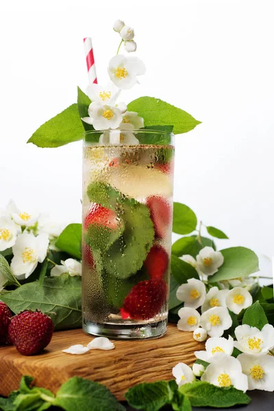 Summer cooling non-alcoholic cocktail. Green tea, strawberries,