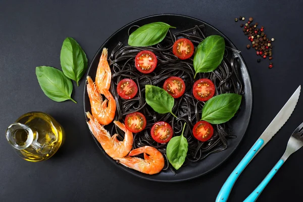 Black pasta (with black cuttlefish ink), cherry tomatoes, shrimp