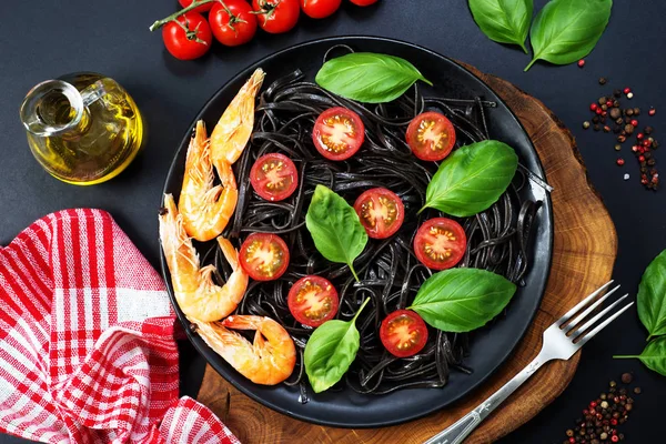 Black pasta (with black cuttlefish ink), cherry tomatoes, shrimp
