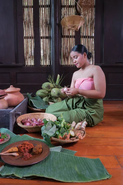 Portrait Asian woman Thai period costume in kitchen