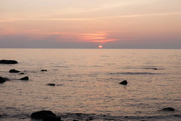 The sea sunset. Pink landscape.