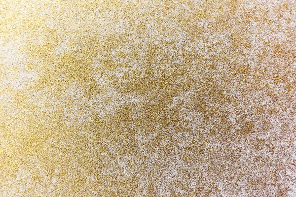 Golden glitter Texture. Gold powder background.