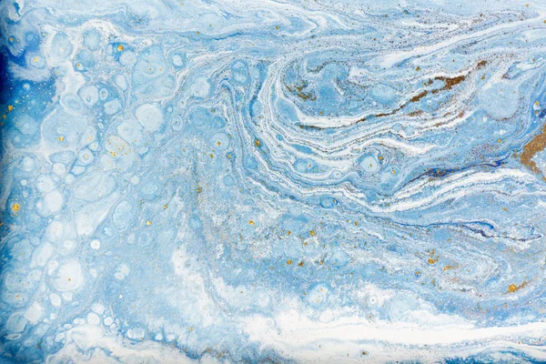 Blue and white marbling pattern with gold glitter. Marble liquid texture.