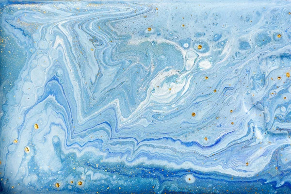 Blue and white marbling pattern with gold glitter. Marble liquid texture.