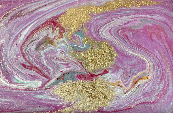 Pink and gold marbling pattern. Golden marble liquid texture.