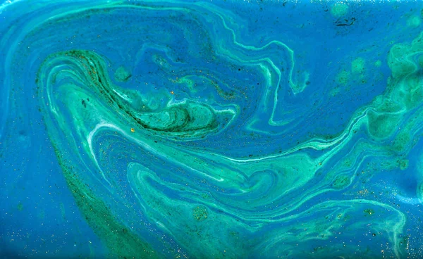 Blue, green and gold marbling pattern. Golden powder marble liquid texture.