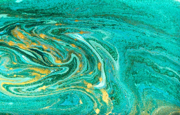 Green and gold marbling pattern. Golden powder marble liquid texture.