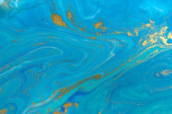 Marbled blue and gold abstract background. Liquid marble pattern.