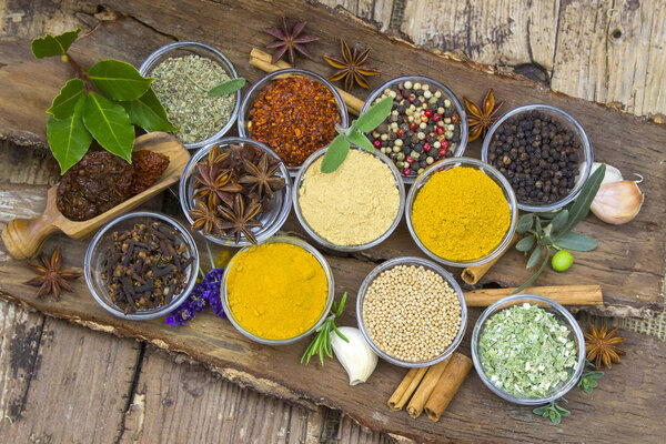 Variety of spices on wooden background