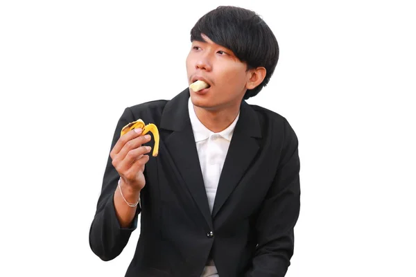 Молодой Красивый Мужчина Ест Банан Белом Фоне — стоковое фото