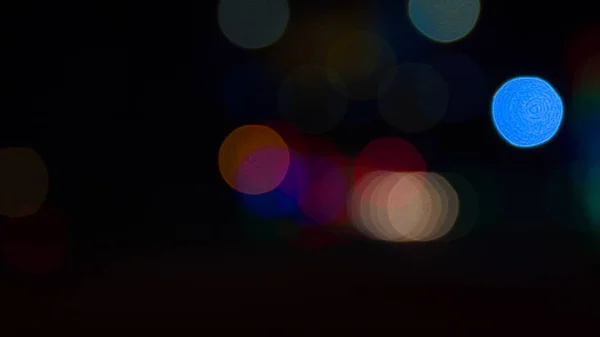 Abstrato desfocado bokeh na noite da cidade colorido — Fotografia de Stock