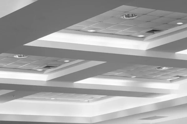 ceiling of business interior office building and light neon