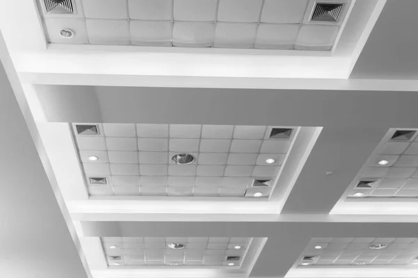 ceiling of business interior office building and light neon