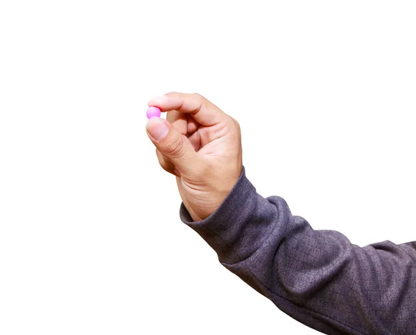 Píldoras de color rosa en la mano masculina aislado sobre fondo blanco — Foto de Stock