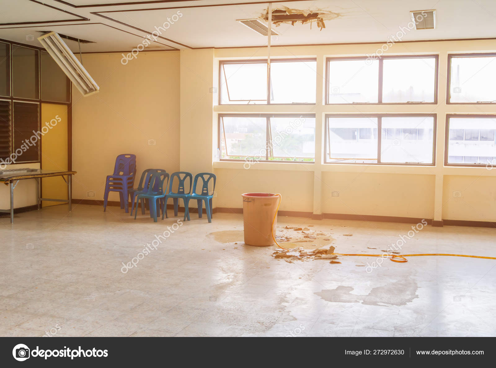 Water Leak Drop Interior Office Building In Red Bucket From