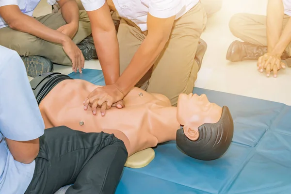 CPR aid dummy medical training with hand press Heart on doll emergency