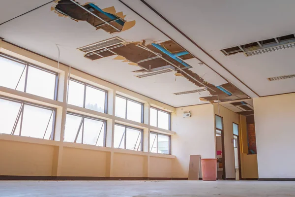 Repair leak water pipe in under gypsum ceiling interior office — Stock Photo, Image