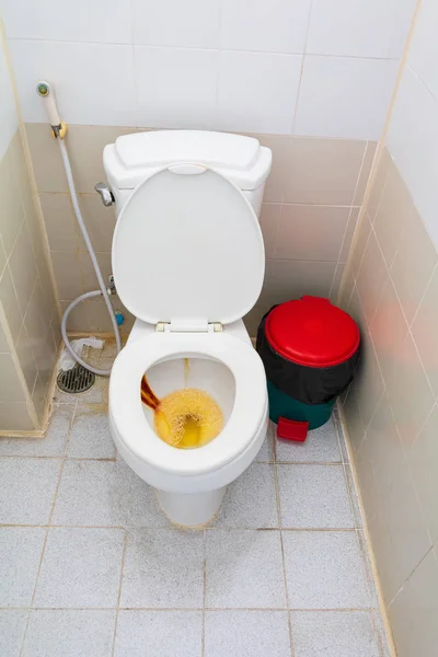 Toilet white bowl ceramic full of urine in lavatory room public — Stock Photo, Image