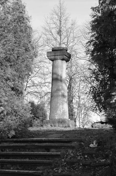 black and white photo of a column on the top of the stairs in the park, Frydek-Mistek, Czech Republic
