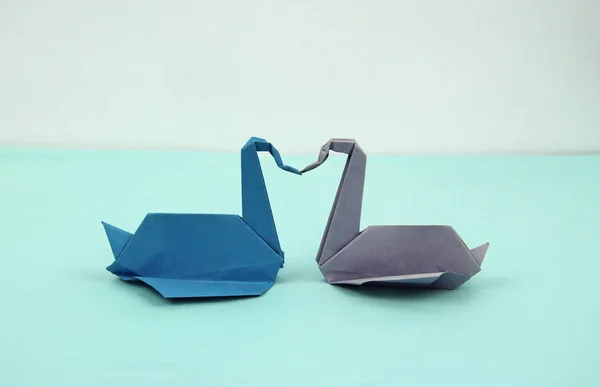 blue and purple origami paper swans, loving couple