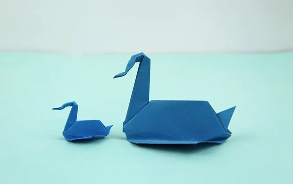 blue origami paper swans, big and small, single parent concept