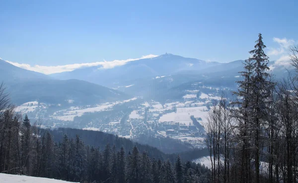 view on Beskydy mountains in the mist on sunny winter day, Czech Republic