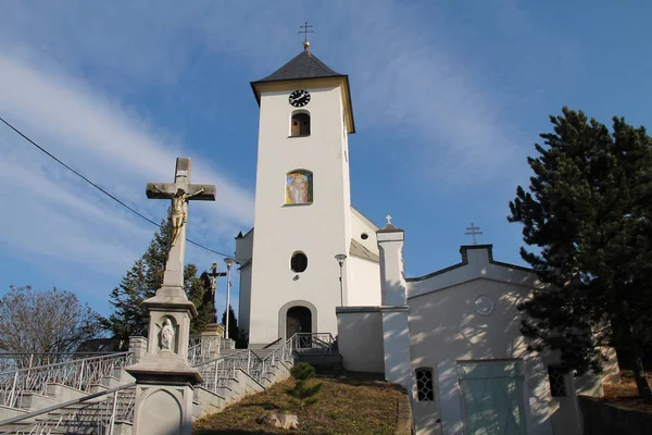 nice white church and a cross in Albrechticky, Czech Republic