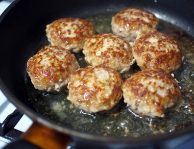 Fried in sunflower oil patties in a frying pan