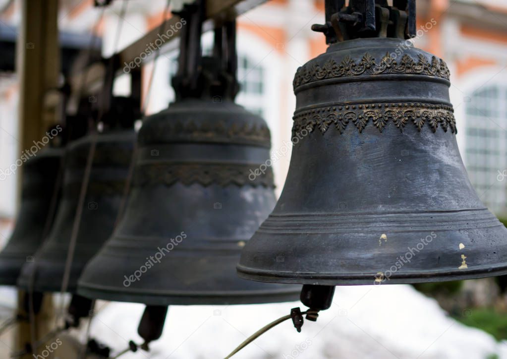 Vintage bronze church bells hanging on the belfry